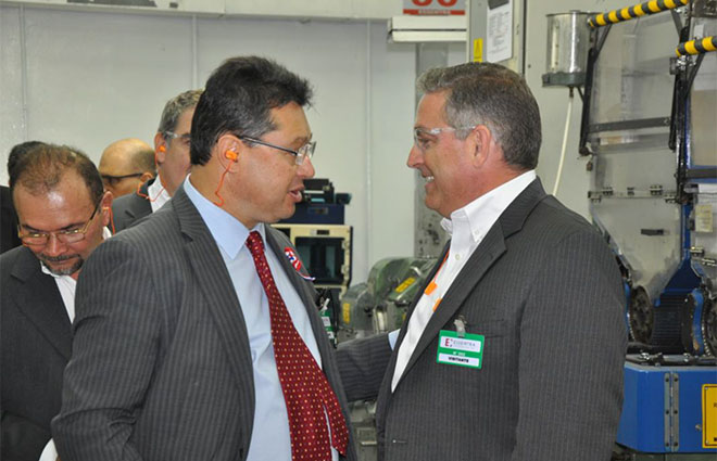 Brett York, President – Essentra Americas (right) welcomes Minister Leite (left) to site